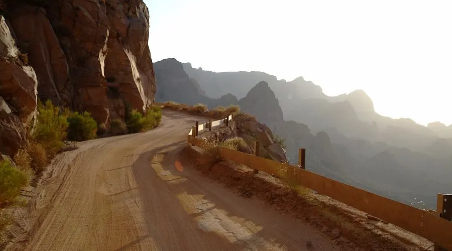 Dirt ridgeline trail climbing the Apache Trail with panoramic Arizona desert views