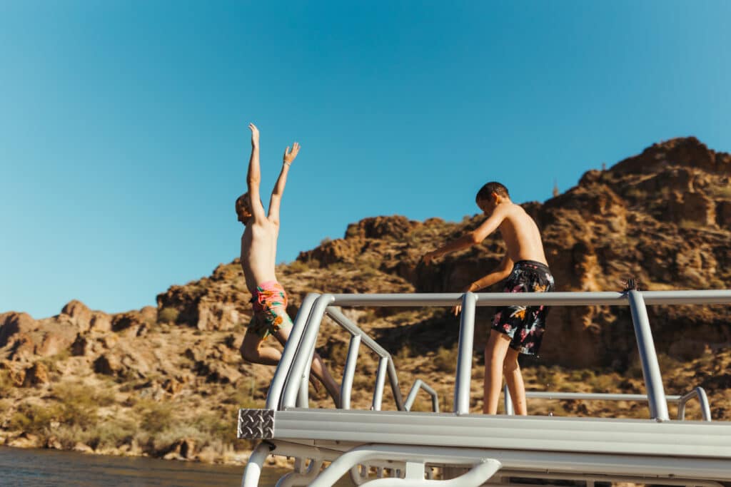 Leaping Off The Back Of A Pontoon Boat Into Canyon Lake, Arizona