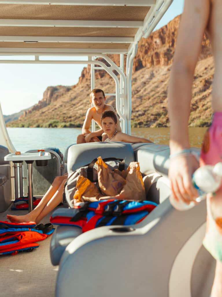 Friends Relaxing Aboard A Sea-Doo Switch Pontoon On An Arizona Lake