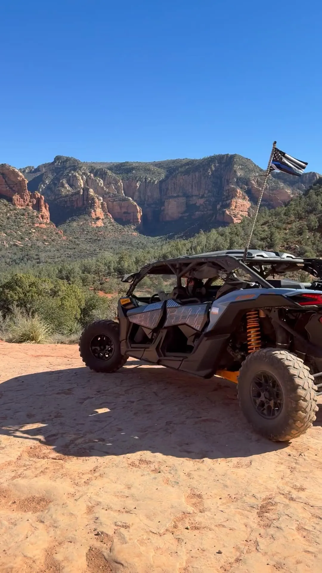 Four-seat Can-Am Maverick X3 side-by-side with 3-point harness system ready for trail riding