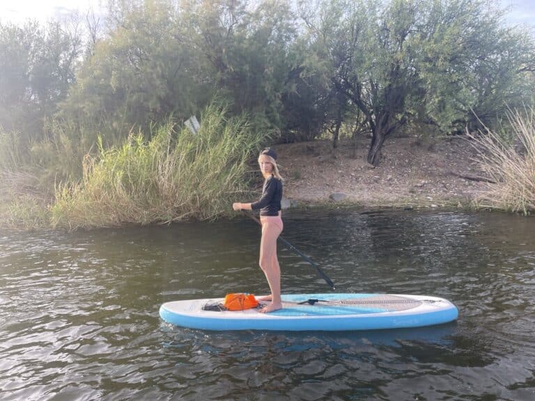 Stand-Up Paddleboarder Drifting Down The Salt River Near Mesa, Arizona